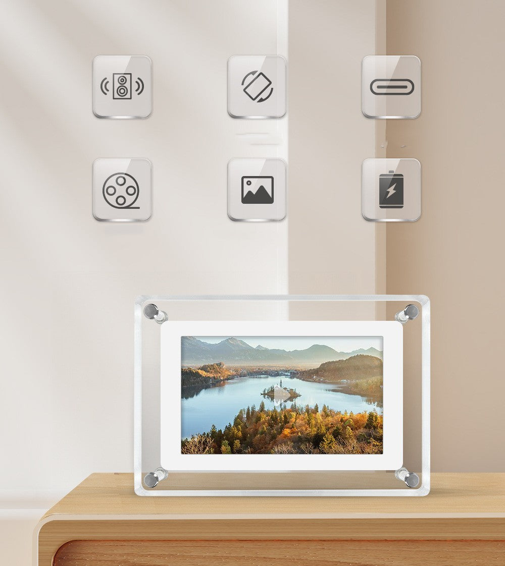 Digital photo frame on a wooden surface with control buttons on the wall above.